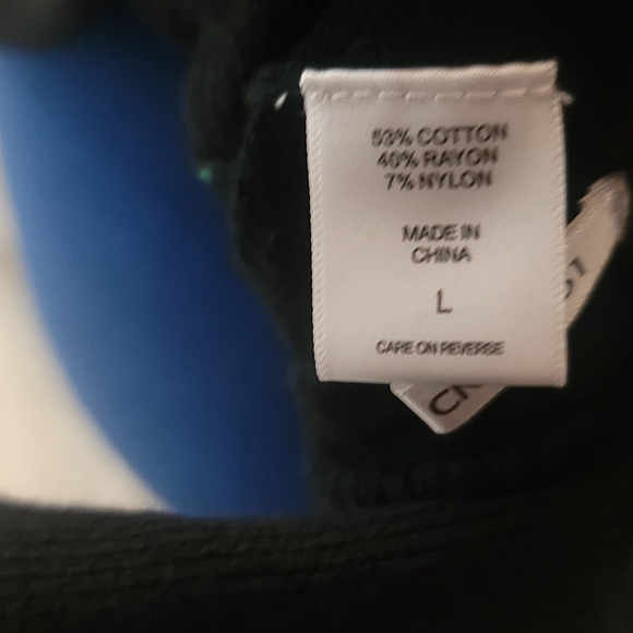 Black sweater with twisted back and lace sleeve detail. - Picture 6 of 7